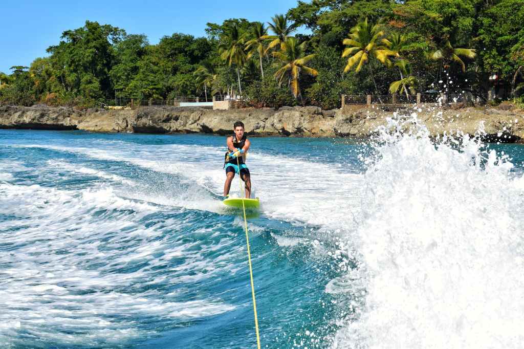 a young man doing water skiing