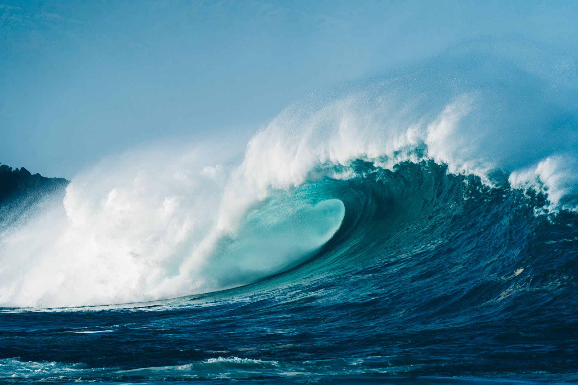 foamy wave rolling over azure sea surface