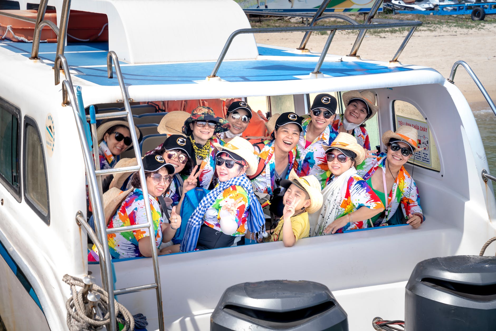 group of people riding on white boat